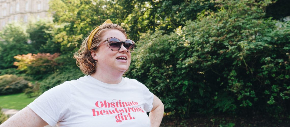 Jo Hooper in a t shirt that reads: obstinate headstrong girl, showing how to stick it to the patriarchy in your business